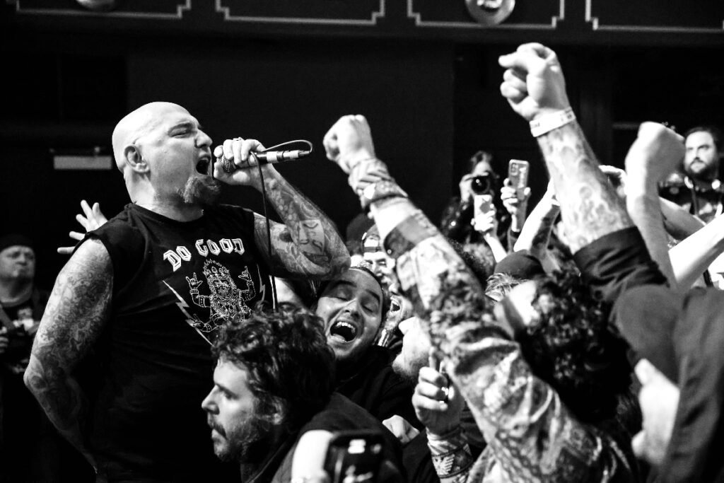 Crowd singing along to punk rock music